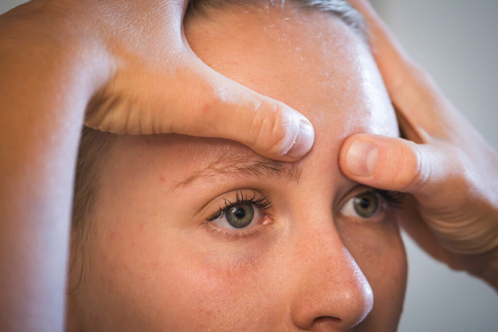 Specialist physiotherapist in Basel testing trigeminal nerve sensitivity in a patient with dizziness